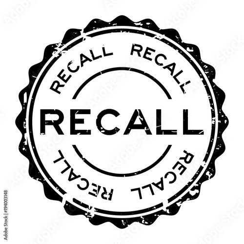 Grunge black recall word round rubber seal stamp on white background