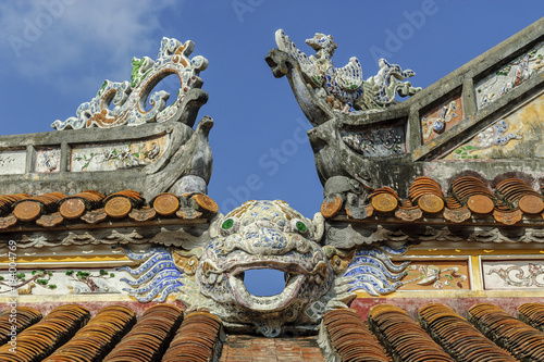detail of the roofs of a building inside the imperial citadel of Hue, Vietnam. 
