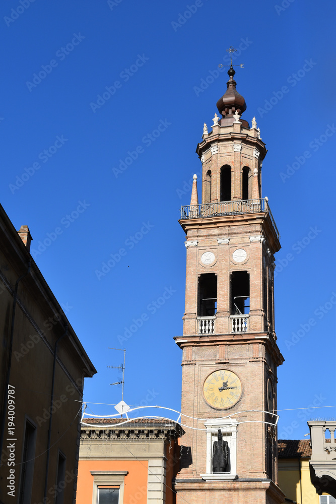 A tower with clock in Parma, Italy, with blue limpid sky in a sunny day.