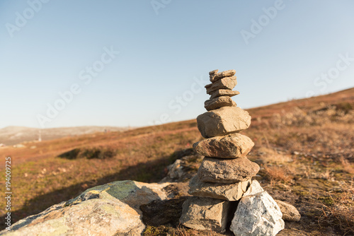 Stack of natural irregular stones in grassland