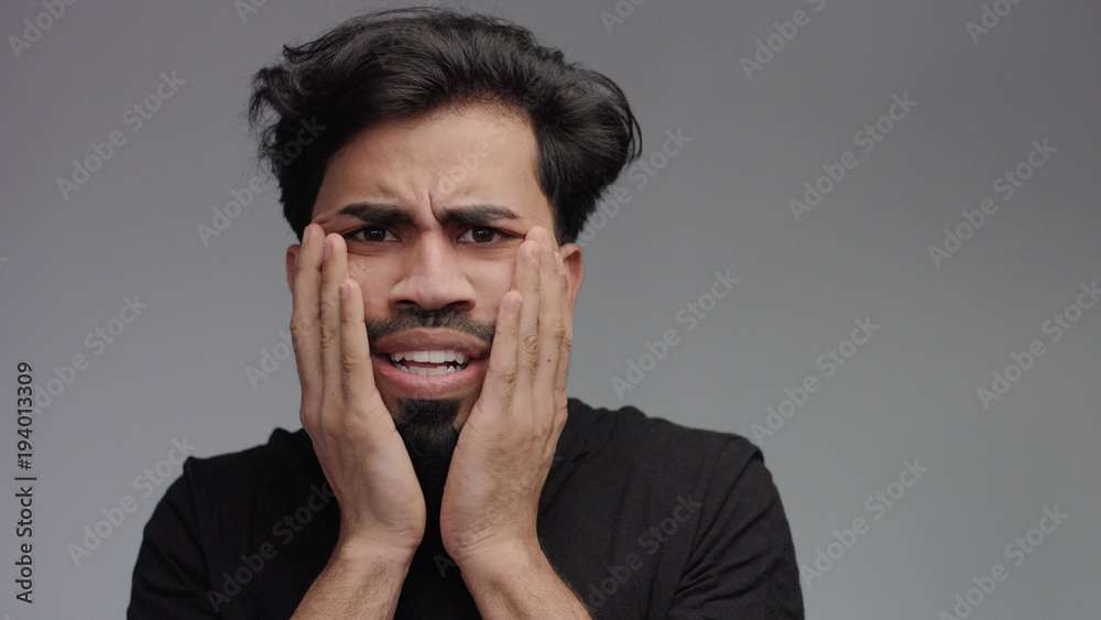 paranoic strange stressed man lookin weird touching his face paranoic strange stressed man lookin weird touching his face