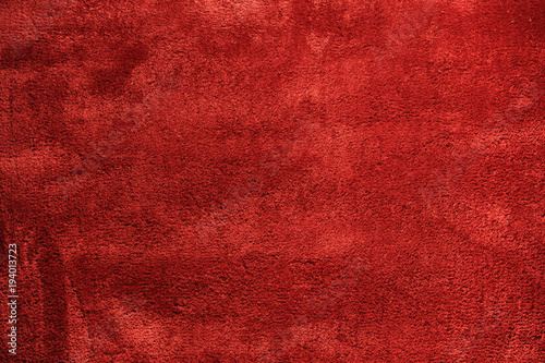 Tekstura miękkiego, czerwonego dywanu.