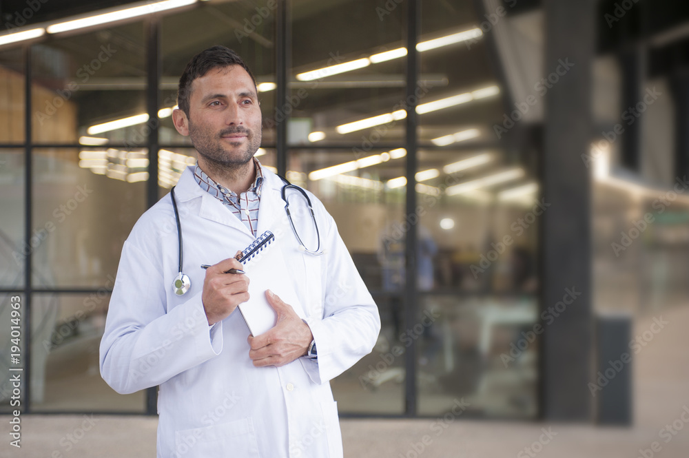 handsome doctor in a medical center handsome doctor in a medical center