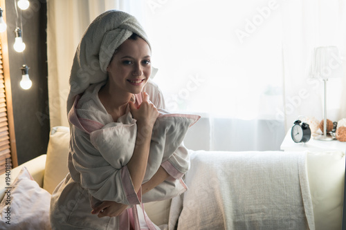 woman in a house dressing gown and with a towel