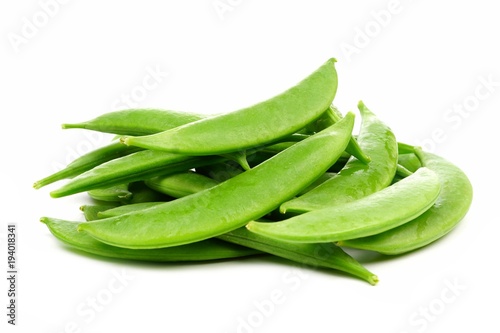 Pile of fresh snap peas. Side view isolated on a white background.