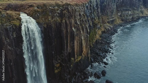 Aerial reveal of Kilt Rock and Mealt Falls from the Isle of Skye in Scotland, UK