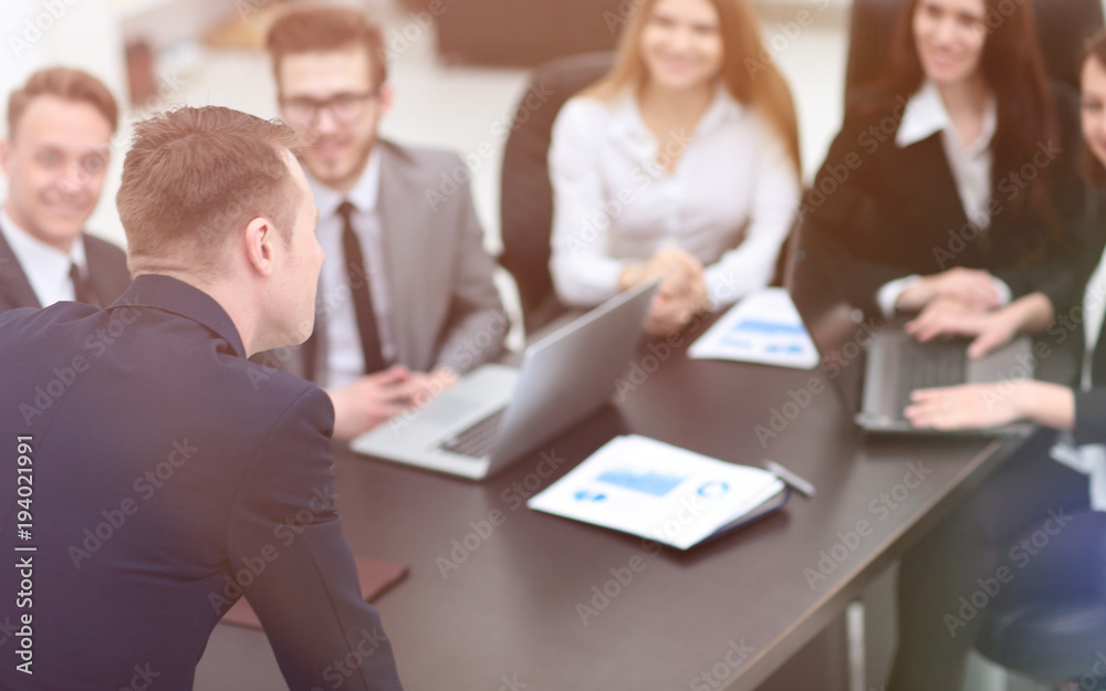 blurred image of business team at a Desk blurred image of business team at a Desk