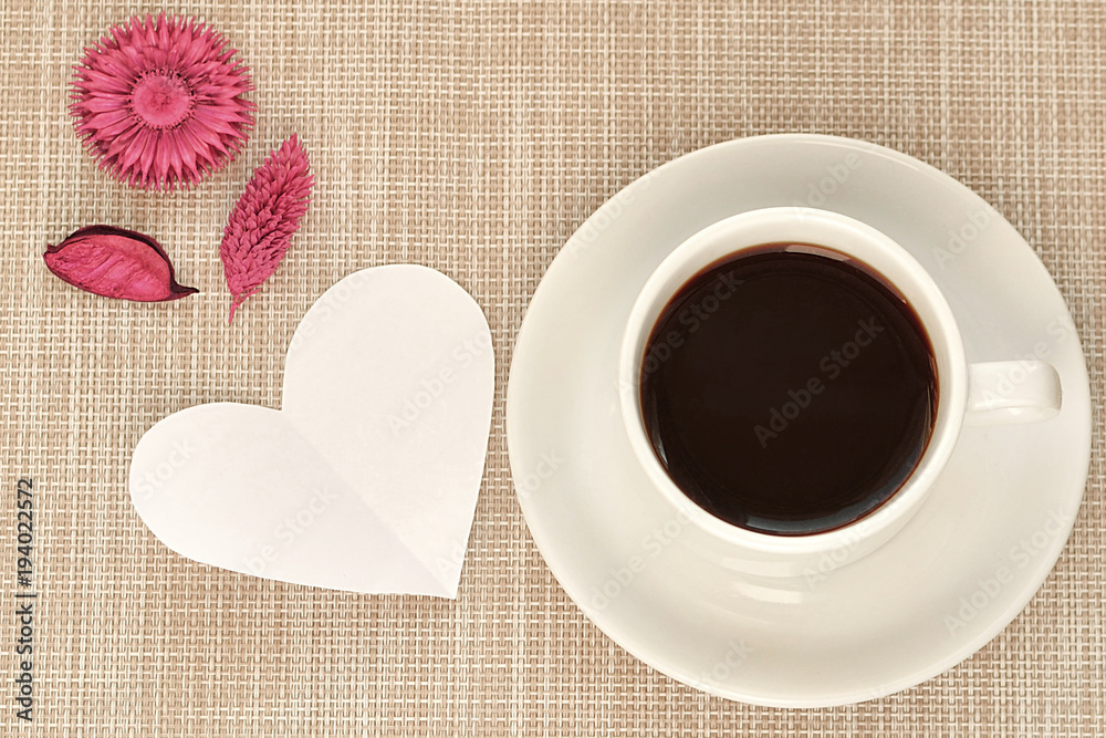 White cup and saucer with a braun background White cup and saucer with a braun background