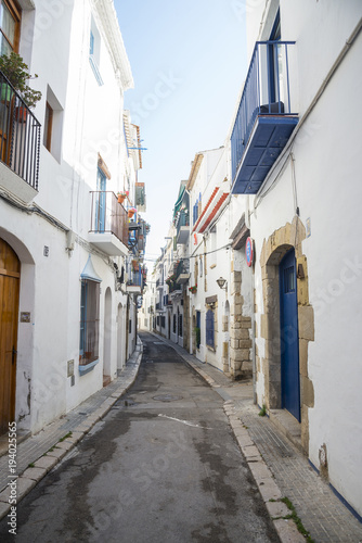 Medieval street in Sitges, Spain © Olivia