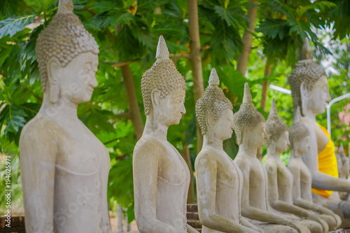 Close up of Ancient Buddha Statue at WAT YAI CHAI MONGKOL, The Historic City of Ayutthaya, Thailand photo