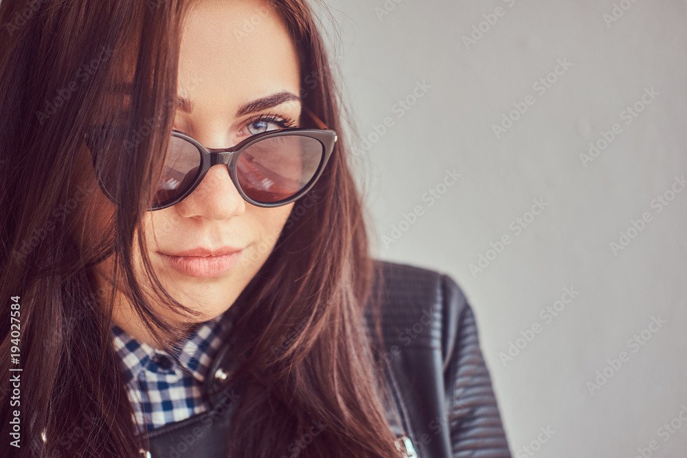 Close-up portrait of a handsome Caucasian brunette on a white ba Close-up portrait of a handsome Caucasian brunette on a white ba