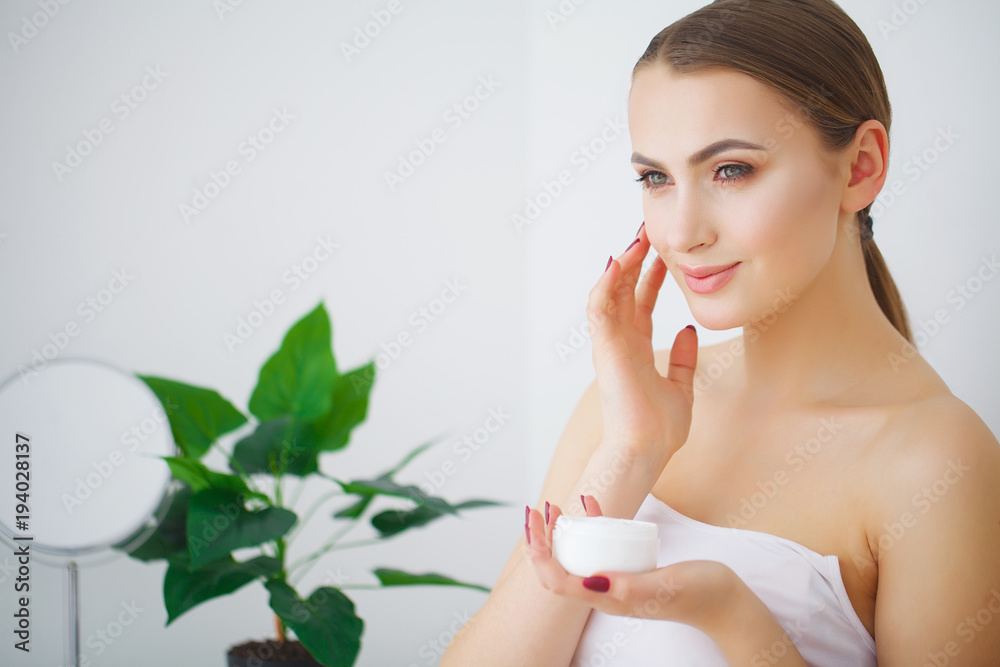 Beautiful young smiling woman with clean fresh skin look away .Girl beauty face care. Facial treatment . Cosmetology , beauty and spa . Beautiful young smiling woman with clean fresh skin look away .Girl beauty face care. Facial treatment . Cosmetology , beauty and spa .