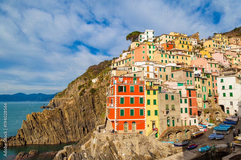 Riomaggiore - first city of the Cique Terre sequence of five hill cities in Liguria, Italy. Great winter seascape of Mediterranean sea. Travel background.