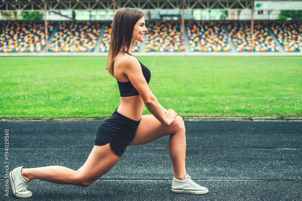 Fototapeta premium Cute young brunette sporty girl workout outdoor