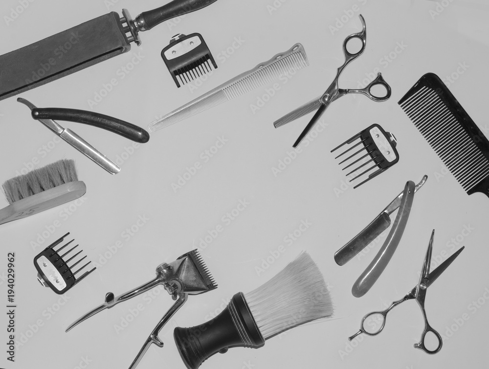Vintage black and white photo with the tools of a hairdresser. In the photo there is fine grain.