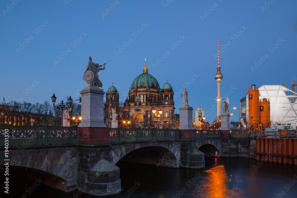BERLIN, GERMANY - FEBRUARY 22, 2017: Beautiful view of historic Berlin Cathedral (Berliner Dom) at famous Museumsinsel (Museum Island) with awesome Schlossbrucke bridge at the foreground