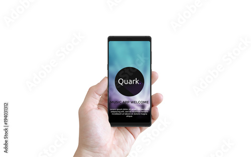 Male holding modern smartphone in left hand with screen mock up