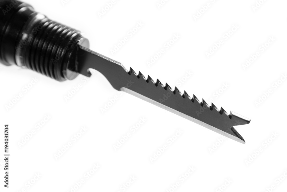 Multifunctional knife with a saw and bottle opener. Object is isolated on white background. Multifunctional knife with a saw and bottle opener. Object is isolated on white background.