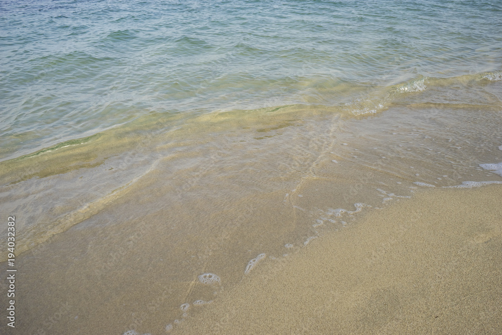 Journey Mediterranean scene, shore of the Mediterranean Sea with barefoot footprints of people in summer Journey Mediterranean scene, shore of the Mediterranean Sea with barefoot footprints of people in summer