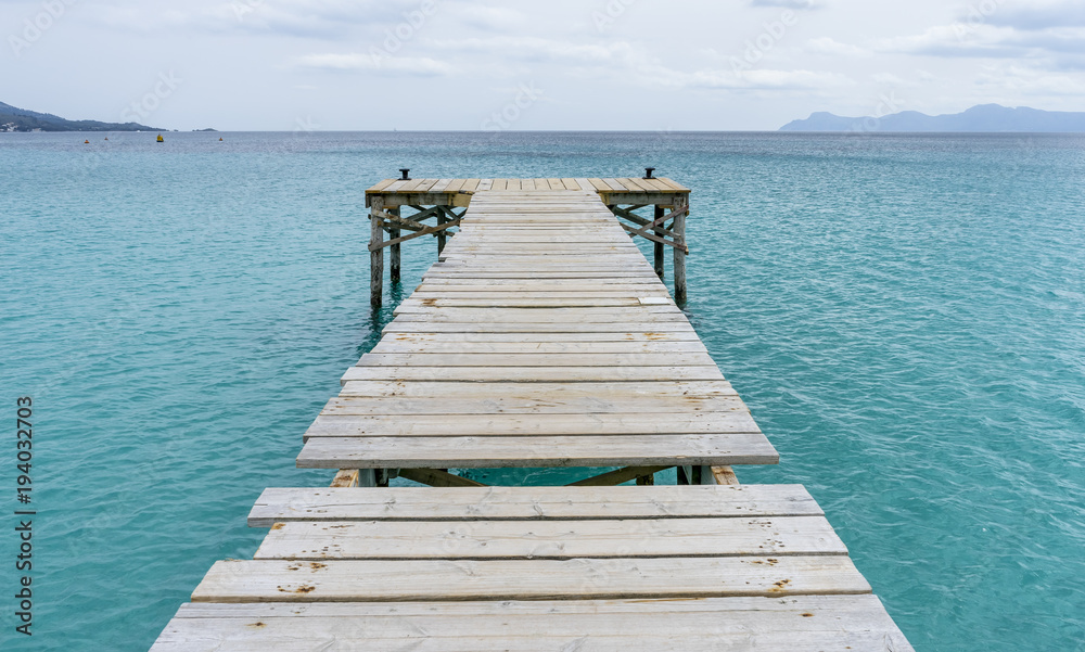 Platform, Wooden pier next to the Mediterranean sea on the island of Ibiza in Spain, holiday and summer scene
