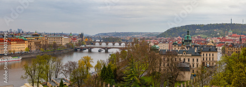 Prague wide panoramic view with old town and river from hill with park Letensky garden. Gloomy weather. photo