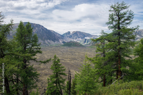 Young volcano among the mountains, Russia, Siberia, Eastern Sayan. photo