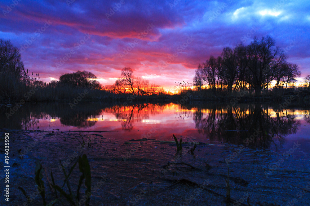 Fototapeta premium spring sunset above the lake