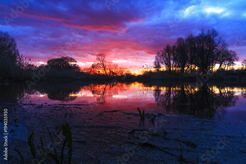 spring sunset above the lake photo