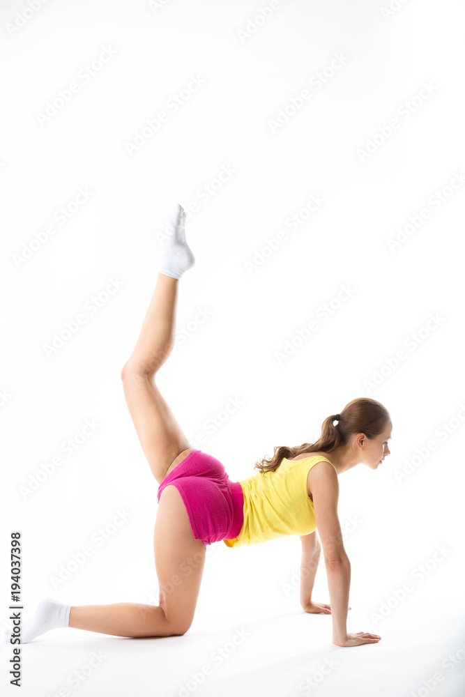 Beautiful sporty woman doing exercise full length isolated on white. Beautiful sporty woman doing exercise full length isolated on white.
