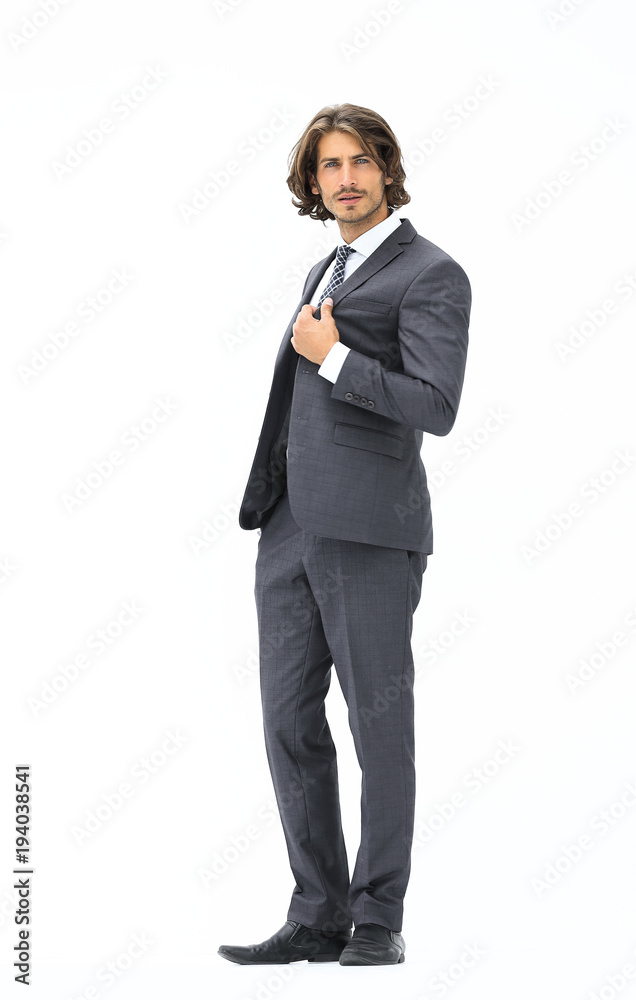 businessman straightening his tie isolated on a white background businessman straightening his tie isolated on a white background