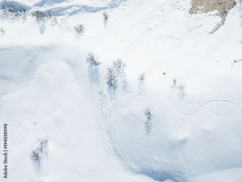 Aerial view of traces of ski in snow covered landscape