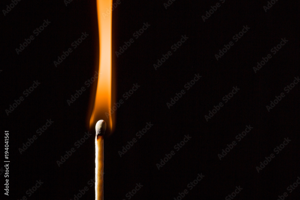 Wooden match on black background Wooden match on black background