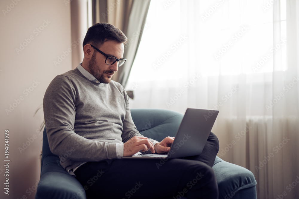 Man working at home on laptop Man working at home on laptop