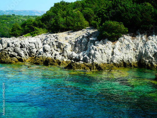 Greece rocky coasline, green, blue, turqouise, aquamarine water, mediterranean sea. © Nataliia