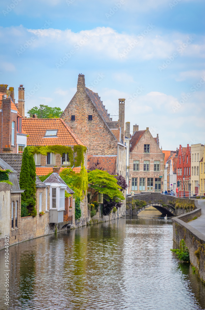 Beautiful canal and traditional houses in the old town of Bruges (Brugge), Belgium