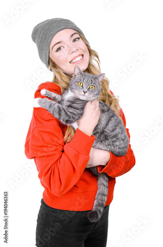 Portrait of young woman with cat on white background. Pet owner