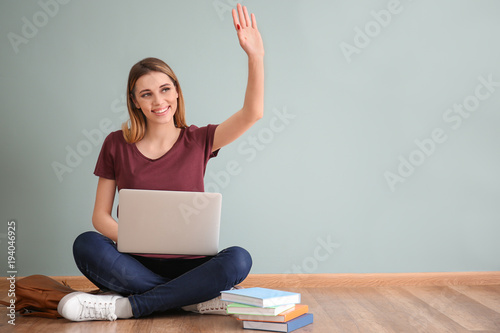 Pretty student with laptop ...