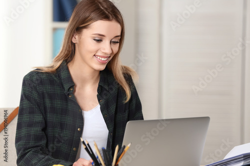 Pretty student with laptop ...