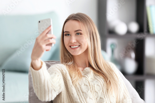 Beautiful woman taking self...