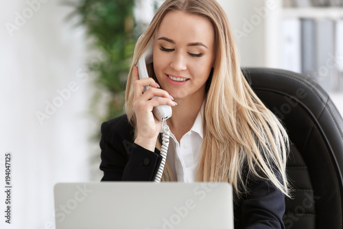 Beautiful woman talking on ...
