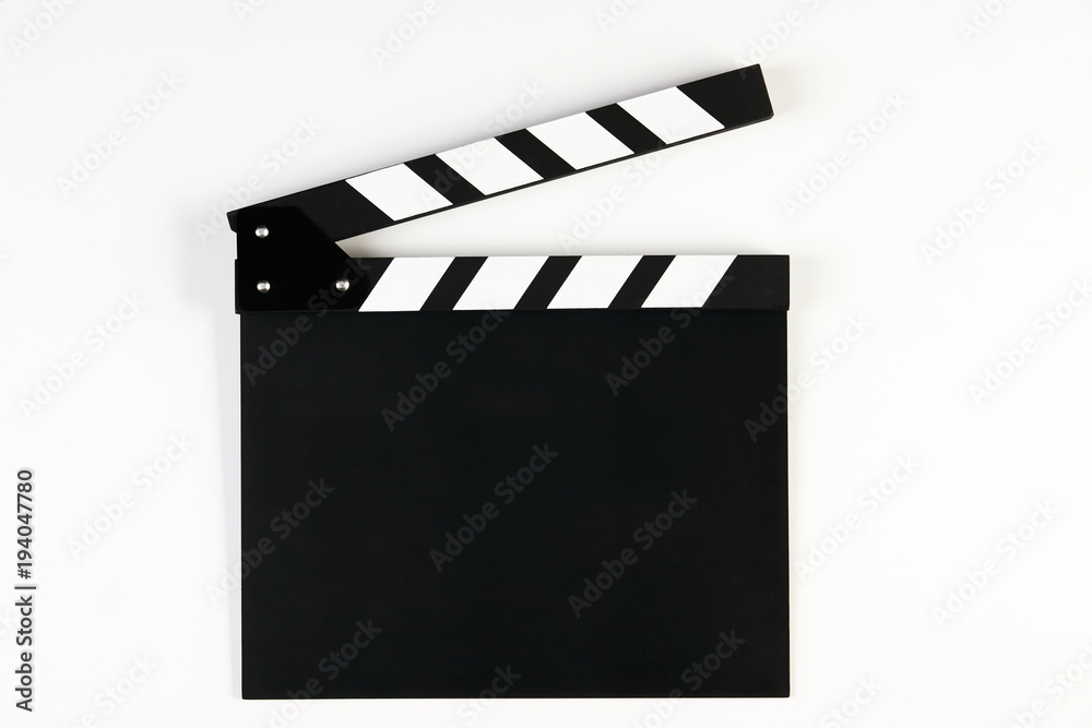Movie production clapper board. Black clapperboard isolated on white background with copy space, close-up. 