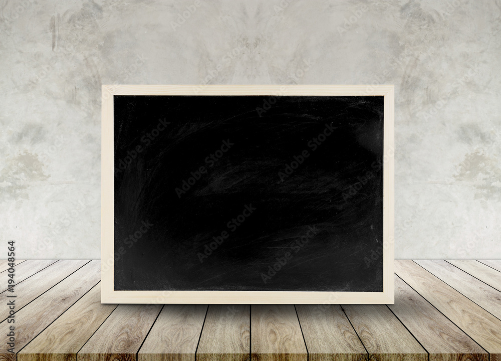 Wooden chalkboard empty table top with cement background, can be used for display your products. Wooden chalkboard empty table top with cement background, can be used for display your products.