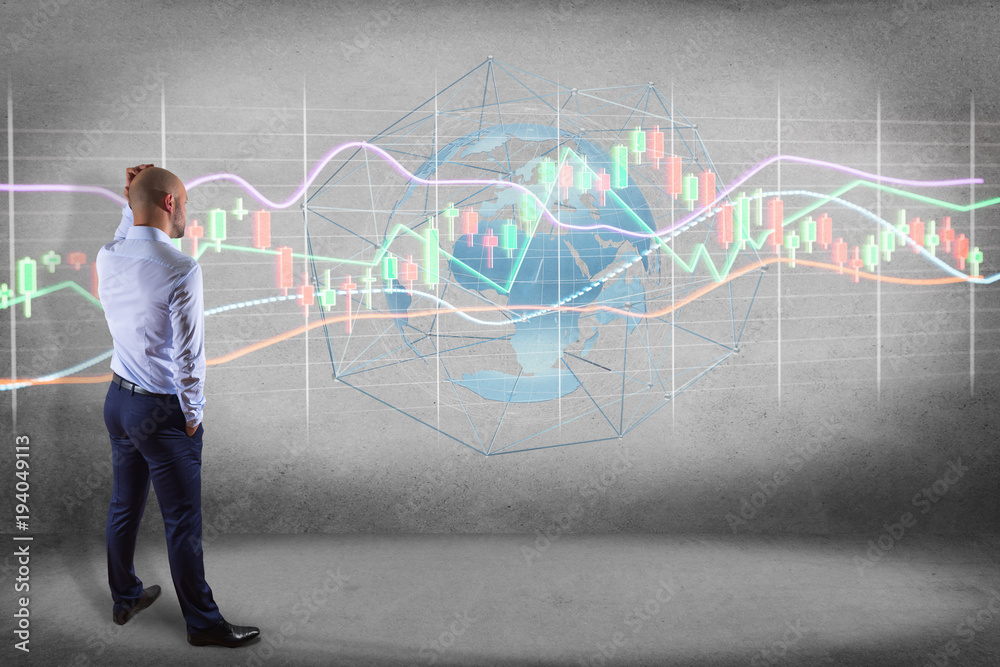Businessman in front of a wall with a 3d render Stock exchange trading data information display on a futuristic interface Businessman in front of a wall with a 3d render Stock exchange trading data information display on a futuristic interface