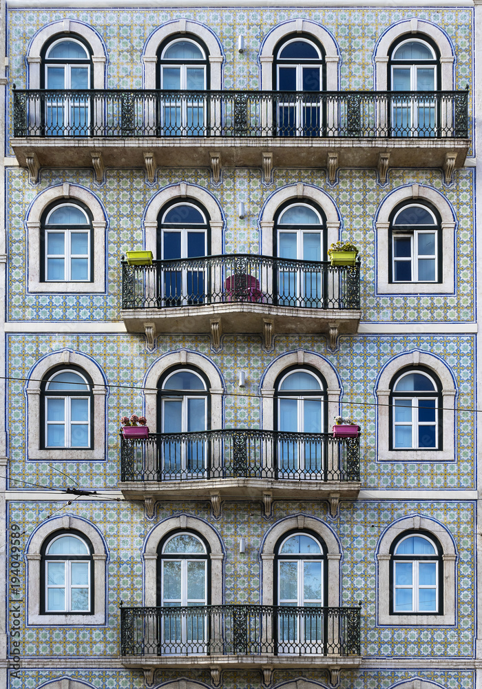 Exterior view of building with ornate balconies Exterior view of building with ornate balconies