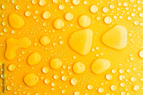 water drops yellow background