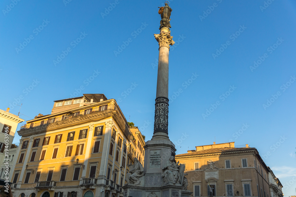 Sunset view of Column of the Immaculate near Spanish Steps and Piazza di Spagna in city of Rome, Italy