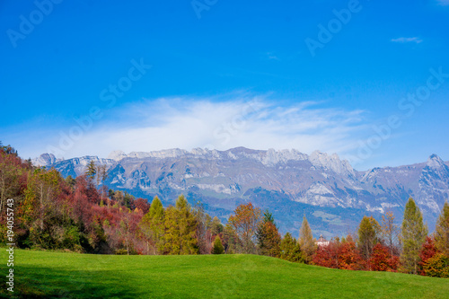 landscape in the Alps with fresh green meadows. Swiss Alps