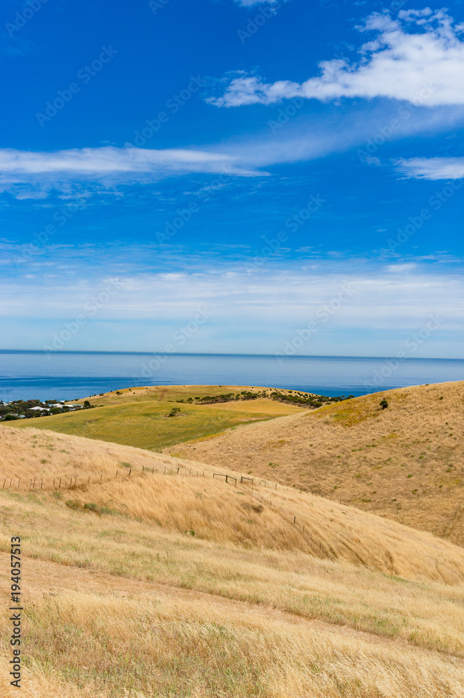 Spectacular landscape with rolling hills and sea on sunny day Spectacular landscape with rolling hills and sea on sunny day
