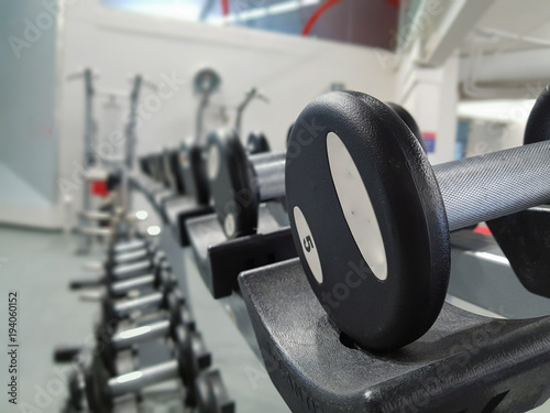 Exercise weights on a rack
