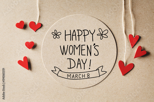 Happy Womens Day message with handmade small paper hearts